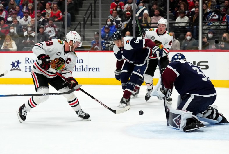 Jan 24, 2022; Denver, Colorado, USA; Chicago Blackhawks center Jonathan Toews (19) attempts to score on Colorado Avalanche goaltender Pavel Francouz (39) in the first period at Ball Arena. Mandatory Credit: Ron Chenoy-USA TODAY Sports