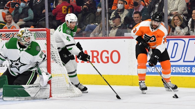 Jan 24, 2022; Philadelphia, Pennsylvania, USA; Philadelphia Flyers defenseman Keith Yandle (3) handles the puck against Dallas Stars defenseman Miro Heiskanen (4) during the second period at Wells Fargo Center. Mandatory Credit: Eric Hartline-USA TODAY Sports