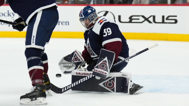 Jan 24, 2022; Denver, Colorado, USA; Colorado Avalanche goaltender Pavel Francouz (39) makes glove save in the first period against the Chicago Blackhawks at Ball Arena. Mandatory Credit: Ron Chenoy-USA TODAY Sports
