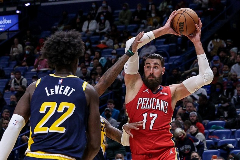 Jan 24, 2022; New Orleans, Louisiana, USA; New Orleans Pelicans center Jonas Valanciunas (17) dribbles against Indiana Pacers guard Caris LeVert (22) during the second half at the Smoothie King Center. Mandatory Credit: Stephen Lew-USA TODAY Sports