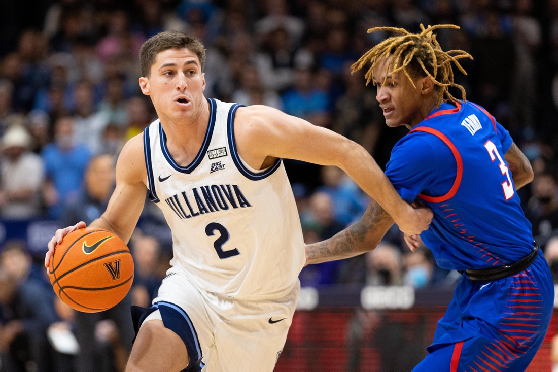 Jan 25, 2022; Villanova, Pennsylvania, USA; Villanova Wildcats guard Collin Gillespie (2) dribbles past DePaul Blue Demons guard Jalen Terry (3) during the first half at William B. Finneran Pavilion. Mandatory Credit: Bill Streicher-USA TODAY Sports