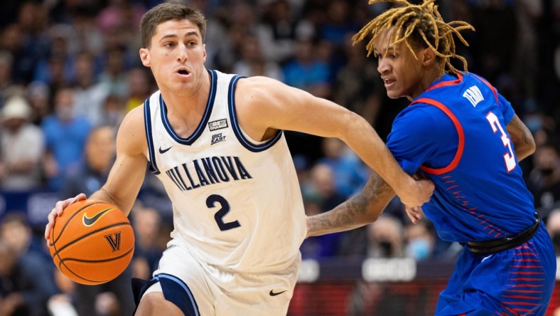 Jan 25, 2022; Villanova, Pennsylvania, USA; Villanova Wildcats guard Collin Gillespie (2) dribbles past DePaul Blue Demons guard Jalen Terry (3) during the first half at William B. Finneran Pavilion. Mandatory Credit: Bill Streicher-USA TODAY Sports