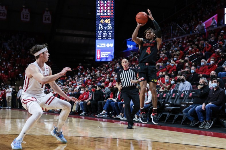 Jan 25, 2022; Piscataway, New Jersey, USA; Maryland Terrapins guard Fatts Russell (4) makes a three point basket as Rutgers Scarlet Knights guard Paul Mulcahy (4) defends during the first half at Jersey Mike's Arena. Mandatory Credit: Vincent Carchietta-USA TODAY Sports