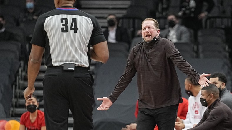 Jan 25, 2022; Toronto, Ontario, CAN; Toronto Raptors head coach Nick Nurse (right) complains to official Kevin Cutler (34) during the first half against the Charlotte Hornets at Scotiabank Arena. Mandatory Credit: John E. Sokolowski-USA TODAY Sports