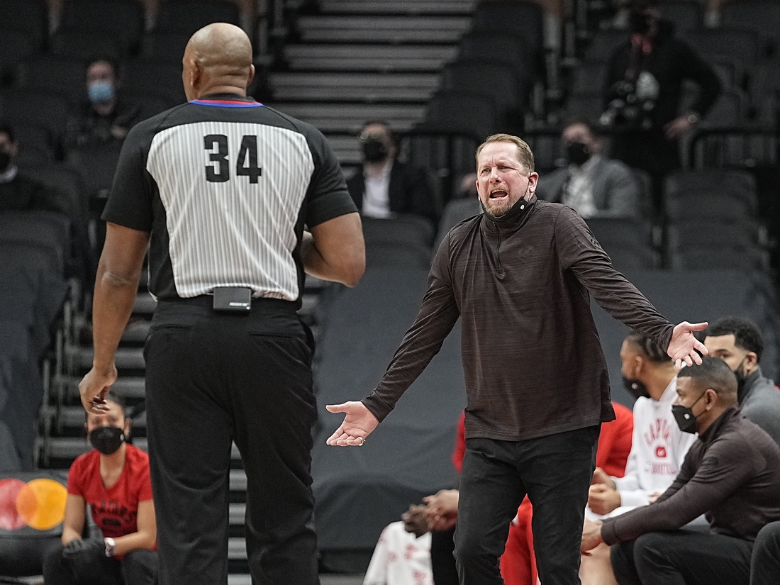 Jan 25, 2022; Toronto, Ontario, CAN; Toronto Raptors head coach Nick Nurse (right) complains to official Kevin Cutler (34) during the first half against the Charlotte Hornets at Scotiabank Arena. Mandatory Credit: John E. Sokolowski-USA TODAY Sports