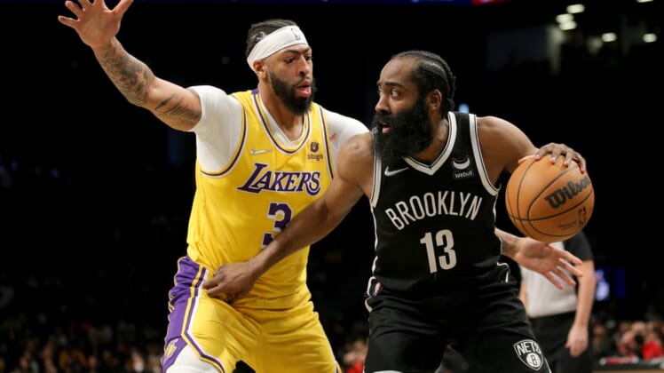 Jan 25, 2022; Brooklyn, New York, USA; Brooklyn Nets guard James Harden (13) controls the ball against Los Angeles Lakers forward Anthony Davis (3) during the third quarter at Barclays Center. Mandatory Credit: Brad Penner-USA TODAY Sports