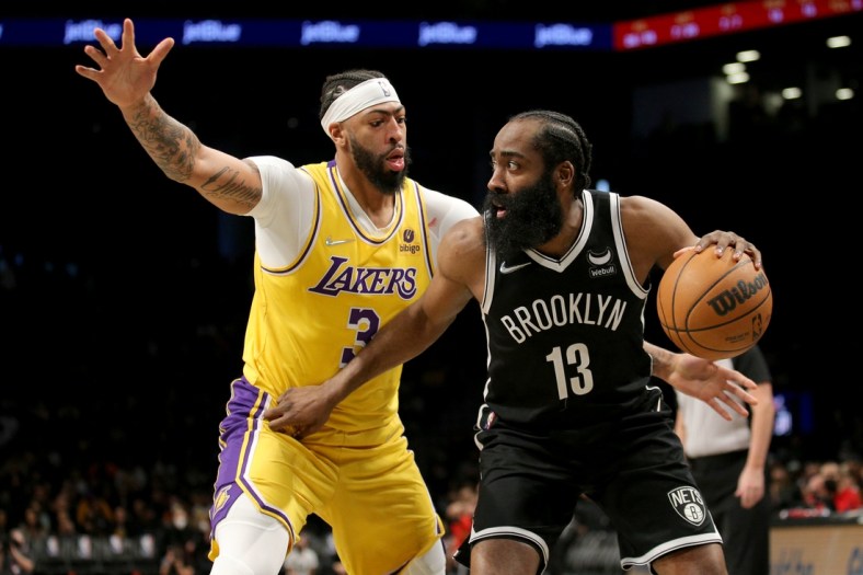 Jan 25, 2022; Brooklyn, New York, USA; Brooklyn Nets guard James Harden (13) controls the ball against Los Angeles Lakers forward Anthony Davis (3) during the third quarter at Barclays Center. Mandatory Credit: Brad Penner-USA TODAY Sports