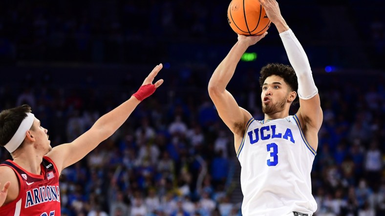 Jan 25, 2022; Los Angeles, California, USA; UCLA Bruins guard Johnny Juzang (3) shoots against Arizona Wildcats guard Kerr Kriisa (25) during the second half at Pauley Pavilion. Mandatory Credit: Gary A. Vasquez-USA TODAY Sports