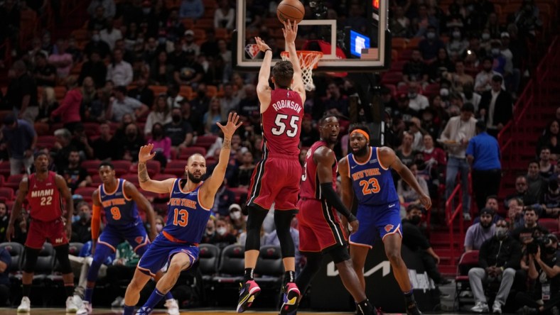 Jan 26, 2022; Miami, Florida, USA; Miami Heat guard Duncan Robinson (55) attempts a three point shot over New York Knicks guard Evan Fournier (13) during the first half at FTX Arena. Mandatory Credit: Jasen Vinlove-USA TODAY Sports