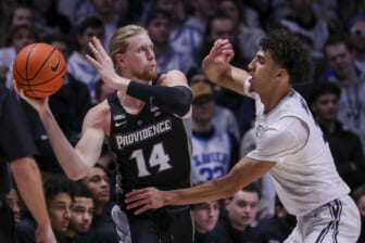 Jan 26, 2022; Cincinnati, Ohio, USA; Providence Friars forward Noah Horchler (14) controls the ball against Xavier Musketeers guard Colby Jones (3) in the second half at Cintas Center. Mandatory Credit: Katie Stratman-USA TODAY Sports