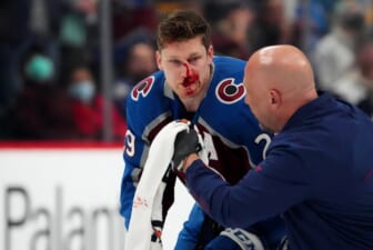 Jan 26, 2022; Denver, Colorado, USA; Colorado Avalanche center Nathan MacKinnon (29) is treated for an injury in the first period against the Boston Bruins at Ball Arena. Mandatory Credit: Ron Chenoy-USA TODAY Sports
