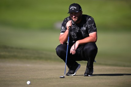 Jan 27, 2022; San Diego, California, USA; Jon Rahm lines up a putt on the ninth green during the second round of the Farmers Insurance Open golf tournament at Torrey Pines Municipal Golf Course - North Course. Mandatory Credit: Orlando Ramirez-USA TODAY Sports