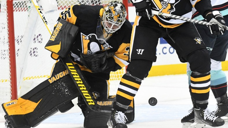 Jan 27, 2022; Pittsburgh, Pennsylvania, USA; Pittsburgh Penguins goalie Tristan Jarry (35) makes a save against the Seattle Kraken during the first periuod at PPG Paints Arena. Mandatory Credit: Philip G. Pavely-USA TODAY Sports