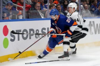 Jan 27, 2022; Elmont, New York, USA; Los Angeles Kings defenseman Mikey Anderson (44) hits New York Islanders right wing Kyle Palmieri (21) during the second period at UBS Arena. Mandatory Credit: Brad Penner-USA TODAY Sports