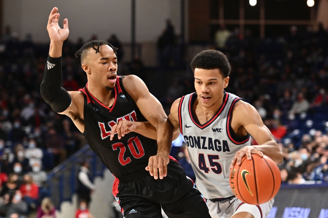 Jan 27, 2022; Spokane, Washington, USA; Gonzaga Bulldogs guard Rasir Bolton (45) runs the lane against Loyola Marymount Lions guard Cam Shelton (20) in the first half at McCarthey Athletic Center. Mandatory Credit: James Snook-USA TODAY Sports