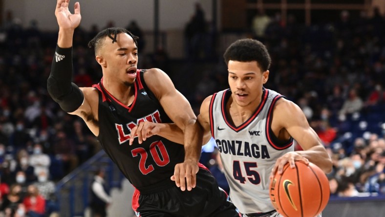 Jan 27, 2022; Spokane, Washington, USA; Gonzaga Bulldogs guard Rasir Bolton (45) runs the lane against Loyola Marymount Lions guard Cam Shelton (20) in the first half at McCarthey Athletic Center. Mandatory Credit: James Snook-USA TODAY Sports