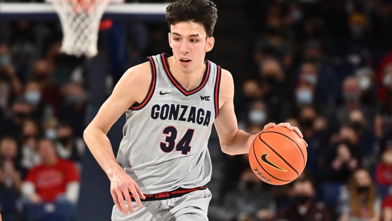 Jan 27, 2022; Spokane, Washington, USA; Gonzaga Bulldogs center Chet Holmgren (34) brings the ball down court against the Loyola Marymount Lions in the second half at McCarthey Athletic Center. Gonzaga won 89-55. Mandatory Credit: James Snook-USA TODAY Sports