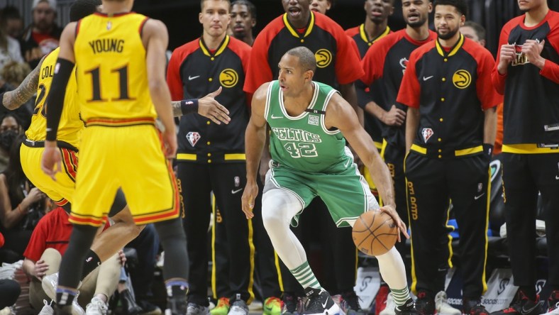 Jan 28, 2022; Atlanta, Georgia, USA; Boston Celtics center Al Horford (42) drives to the basket against the Atlanta Hawks in the first quarter at State Farm Arena. Mandatory Credit: Brett Davis-USA TODAY Sports