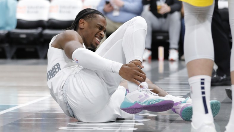 Jan 28, 2022; Oklahoma City, Oklahoma, USA; Oklahoma City Thunder guard Shai Gilgeous-Alexander (2) grabs his ankle after following a play against the Indiana Pacers during the second half at Paycom Center. Indiana won 113-110 in overtime. Mandatory Credit: Alonzo Adams-USA TODAY Sports