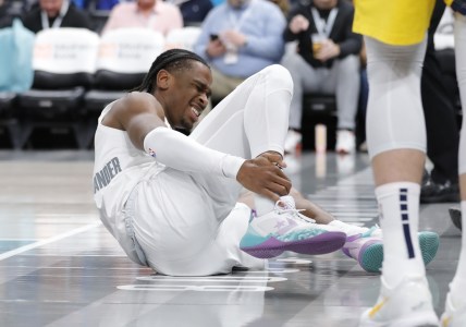 Jan 28, 2022; Oklahoma City, Oklahoma, USA; Oklahoma City Thunder guard Shai Gilgeous-Alexander (2) grabs his ankle after following a play against the Indiana Pacers during the second half at Paycom Center. Indiana won 113-110 in overtime. Mandatory Credit: Alonzo Adams-USA TODAY Sports