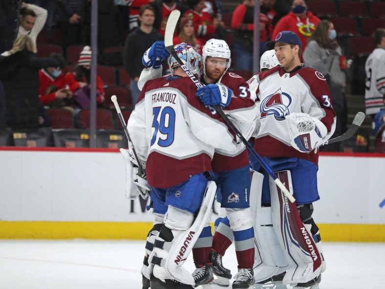Jan 28, 2022; Chicago, Illinois, USA; Colorado Avalanche goaltender Pavel Francouz (39) is congratulated by  left wing J.T. Compher (37) following the third period against the Chicago Blackhawks at the United Center. Mandatory Credit: Dennis Wierzbicki-USA TODAY Sports