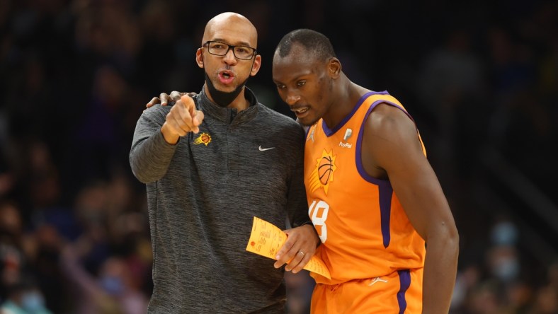 Jan 28, 2022; Phoenix, Arizona, USA; Phoenix Suns head coach Monty Williams (left) with center Bismack Biyombo against the Minnesota Timberwolves in the second half at Footprint Center. Mandatory Credit: Mark J. Rebilas-USA TODAY Sports