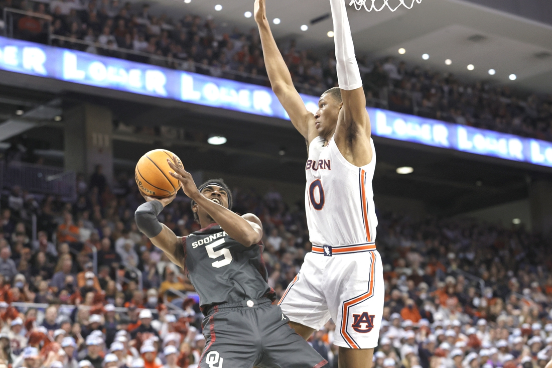 Jan 29, 2022; Auburn, Alabama, USA;  Oklahoma Sooners guard Marvin Johnson (5) takes a shot against Auburn Tigers forward Jabari Smith (10) during the first half at Auburn Arena. Mandatory Credit: John Reed-USA TODAY Sports