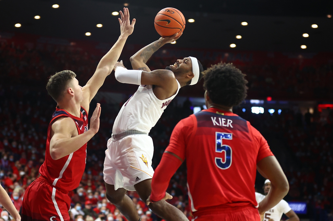 Jan 29, 2022; Tucson, Arizona, USA; Arizona State Sun Devils guard Luther Muhammad (1) shoots against Arizona Wildcats guard Pelle Larsson (3) during the first half at McKale Center. Mandatory Credit: Mark J. Rebilas-USA TODAY Sports