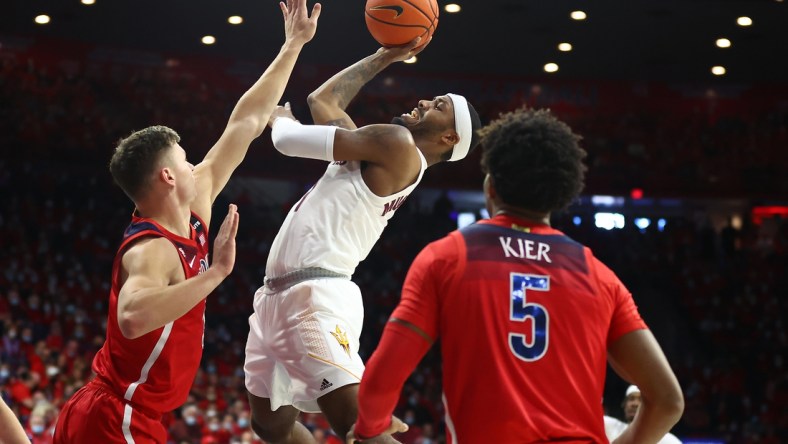 Jan 29, 2022; Tucson, Arizona, USA; Arizona State Sun Devils guard Luther Muhammad (1) shoots against Arizona Wildcats guard Pelle Larsson (3) during the first half at McKale Center. Mandatory Credit: Mark J. Rebilas-USA TODAY Sports