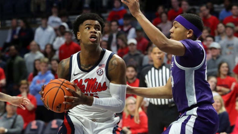 Jan 29, 2022; Oxford, Mississippi, USA; Mississippi Rebels guard-forward Luis Rodriguez (15) drives to the basket as Kansas State Wildcats guard Nijel Pack (24) defends during the first half at The Sandy and John Black Pavilion at Ole Miss. Mandatory Credit: Petre Thomas-USA TODAY Sports