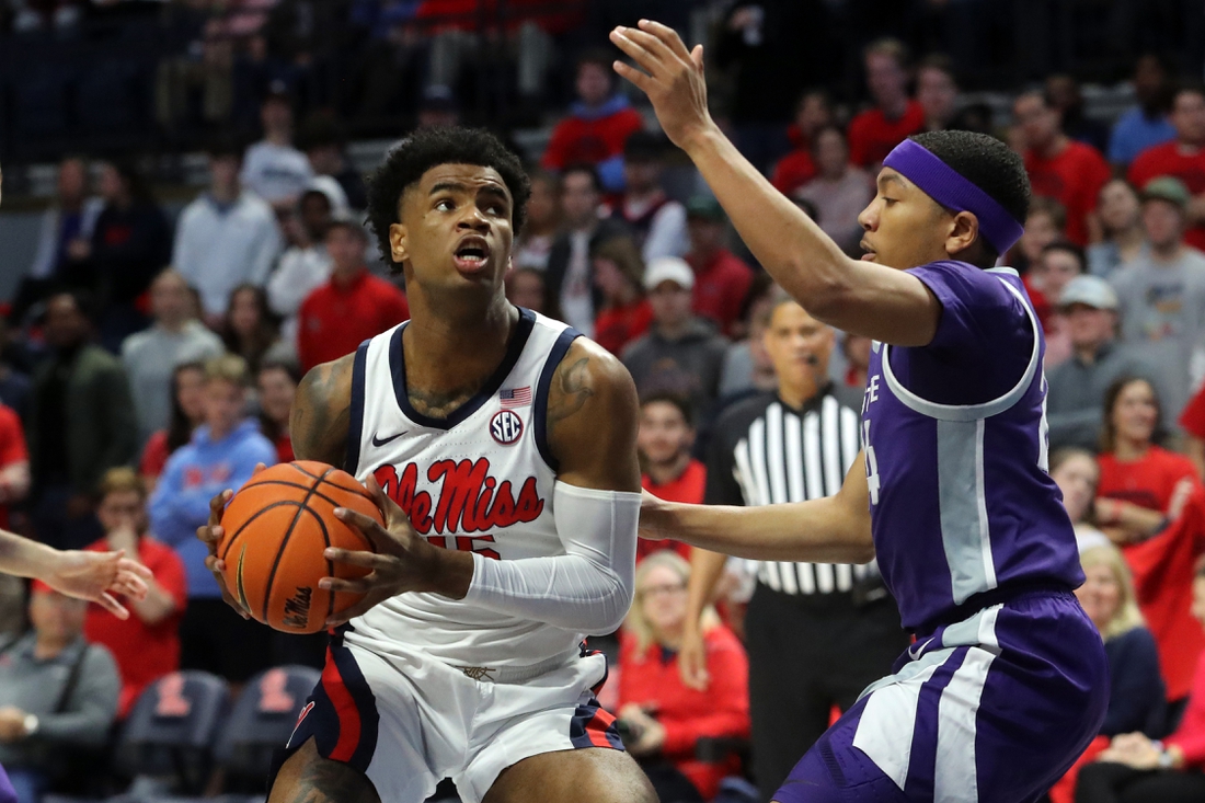 Jan 29, 2022; Oxford, Mississippi, USA; Mississippi Rebels guard-forward Luis Rodriguez (15) drives to the basket as Kansas State Wildcats guard Nijel Pack (24) defends during the first half at The Sandy and John Black Pavilion at Ole Miss. Mandatory Credit: Petre Thomas-USA TODAY Sports