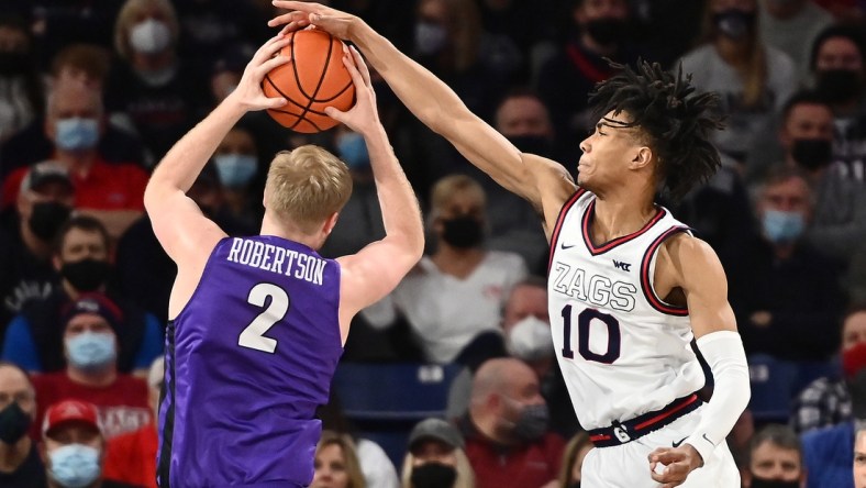 Jan 29, 2022; Spokane, Washington, USA; Portland Pilots guard Tyler Robertson (2) rebounds the ball against Gonzaga Bulldogs guard Hunter Sallis (10) in the first half at McCarthey Athletic Center. Mandatory Credit: James Snook-USA TODAY Sports