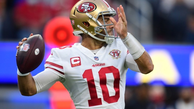 Jan 30, 2022; Inglewood, California, USA;  San Francisco 49ers quarterback Jimmy Garoppolo throws a pass against the Los Angeles Rams during the NFC Championship Game at SoFi Stadium. Mandatory Credit: Gary A. Vasquez-USA TODAY Sports