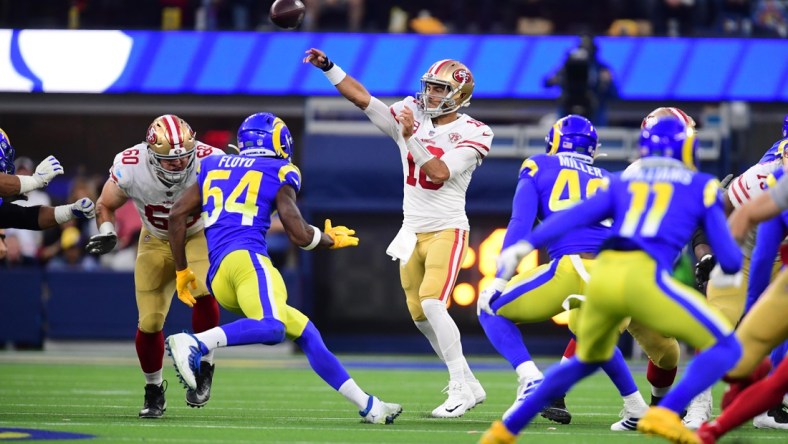 Jan 30, 2022; Inglewood, California, USA; San Francisco 49ers quarterback Jimmy Garoppolo (10) throws a pass against the Los Angeles Rams in the first half during the NFC Championship Game at SoFi Stadium. Mandatory Credit: Gary A. Vasquez-USA TODAY Sports