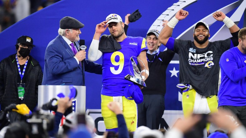 Jan 30, 2022; Inglewood, California, USA; Los Angeles Rams quarterback Matthew Stafford (9) with the George Halas Trophy after defeating the San Francisco 49ers in the NFC Championship Game at SoFi Stadium. Mandatory Credit: Gary A. Vasquez-USA TODAY Sports