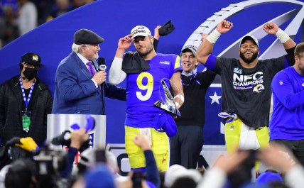 Jan 30, 2022; Inglewood, California, USA; Los Angeles Rams quarterback Matthew Stafford (9) with the George Halas Trophy after defeating the San Francisco 49ers in the NFC Championship Game at SoFi Stadium. Mandatory Credit: Gary A. Vasquez-USA TODAY Sports