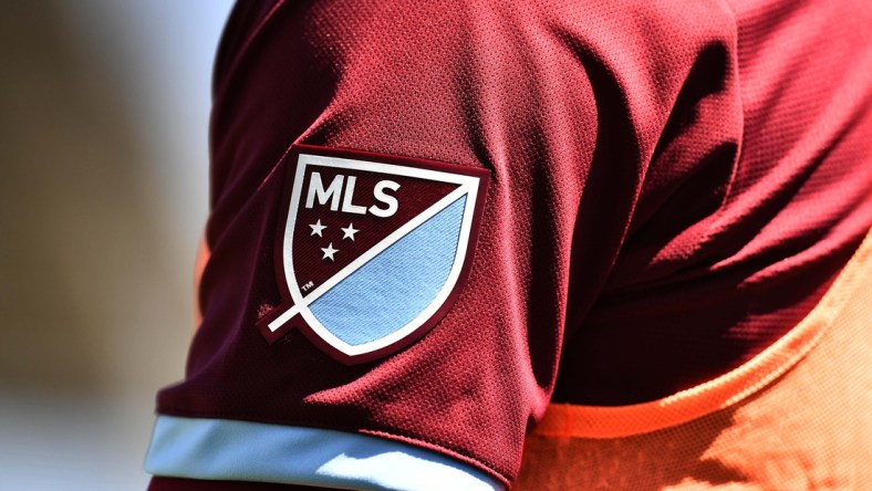 Apr 14, 2018; Commerce City, CO, USA; Detailed view of Colorado Rapids midfielder Dillon Serna (17) MLS emblem logo in the first half of the match against the Toronto FC at Dick's Sporting Goods Park. Mandatory Credit: Ron Chenoy-USA TODAY Sports