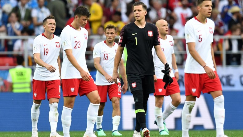 Jun 19, 2018; Moscow, Russia; Poland players walk off the field with goalkeeper Wojciech Szczesny (1) after losing to Senegal in Group H play during the FIFA World Cup 2018 at Spartak Stadium. Mandatory Credit: Tim Groothuis/Witters Sport via USA TODAY Sports