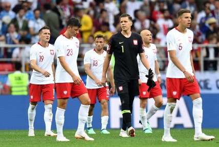 Jun 19, 2018; Moscow, Russia; Poland players walk off the field with goalkeeper Wojciech Szczesny (1) after losing to Senegal in Group H play during the FIFA World Cup 2018 at Spartak Stadium. Mandatory Credit: Tim Groothuis/Witters Sport via USA TODAY Sports