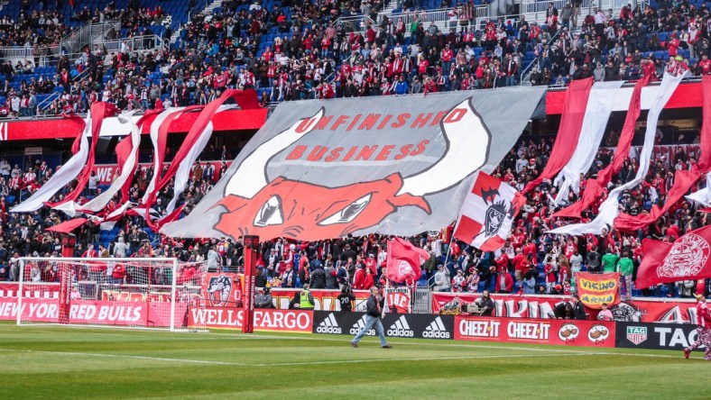 Mar 16, 2019; Harrison, NJ, USA; New York Red Bulls fans unveil a banner that reads "Unfinished Business"  before the game against the San Jose Earthquakes at Red Bull Arena. Mandatory Credit: Vincent Carchietta-USA TODAY Sports