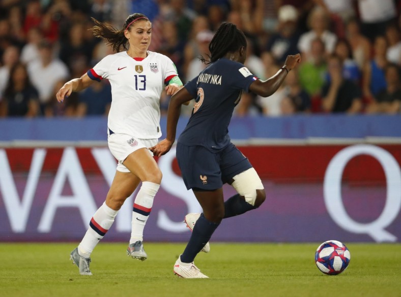 Jun 28, 2019; Paris, FRANCE; United States forward Alex Morgan (13) is defended by France defender Griedge Mbock Bathy (19) in the second half of a quarterfinal match in the FIFA Women's World Cup France 2019 at Parc des Princes. Mandatory Credit: Michael Chow-USA TODAY Sports Griedge Mbock Bathy