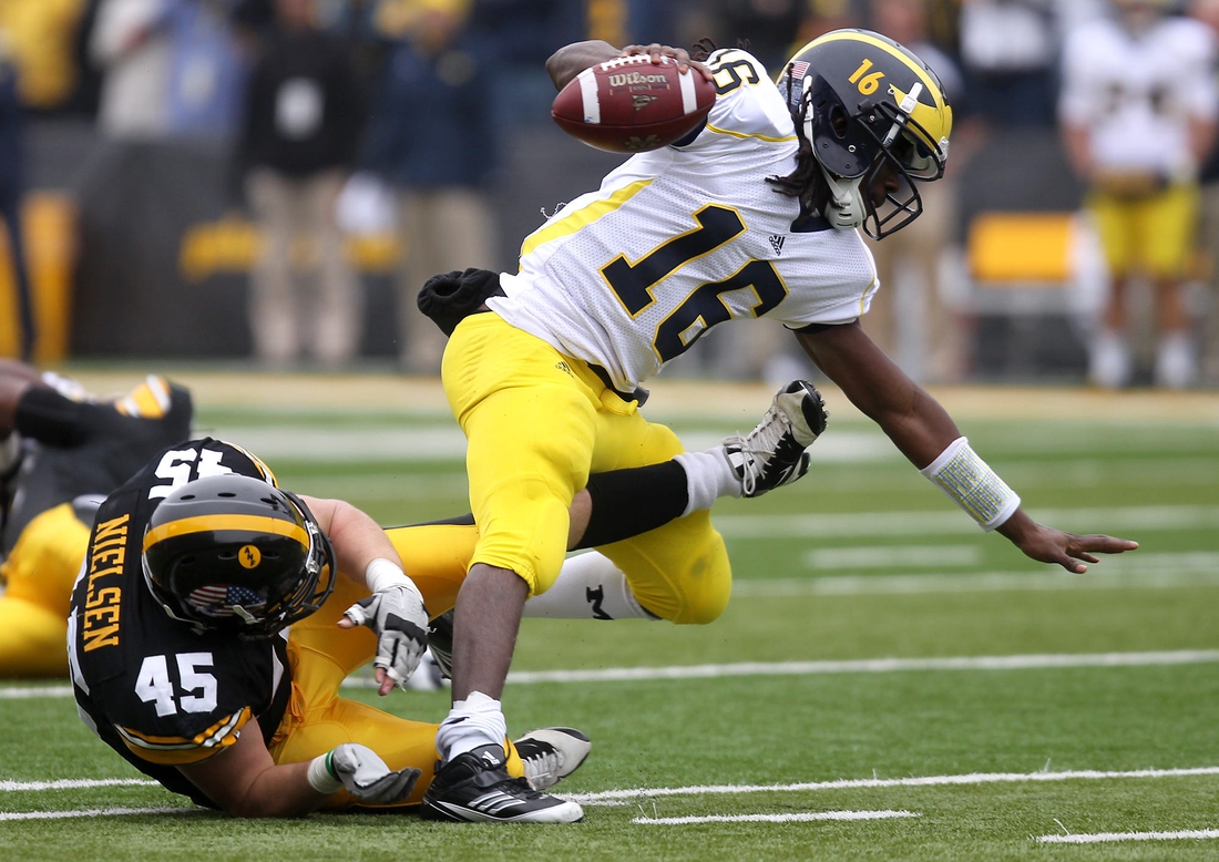 Tyler Nielsen trips up Michigan quarterback Denard Robinson in a game played Nov. 5, 2011 in Iowa City.

Iowbrd 11 06 2011 Pc 1 B005 2011 11 05 Img Iow 1106 Ia Vs Mich 1 1 Aoieg4p Img Iow 1106 Ia Vs Mich 1 1 Aoieg4p