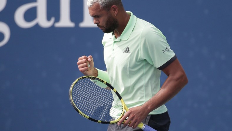 Aug 27, 2019; Flushing, NY, USA; Jo-Wilfried Tsonga of France reacts after winning a point against Tennys Sandgren of the United States in a first round match on day two of the 2019 U.S. Open tennis tournament at USTA Billie Jean King National Tennis Center. Mandatory Credit: Jerry Lai-USA TODAY Sports