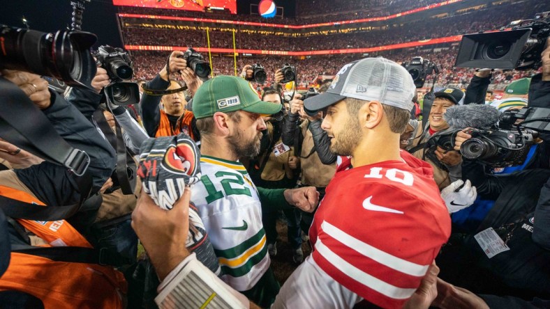 January 19, 2020; Santa Clara, California, USA; Green Bay Packers quarterback Aaron Rodgers (12) congratulates San Francisco 49ers quarterback Jimmy Garoppolo (10) after the NFC Championship Game at Levi's Stadium. Mandatory Credit: Kyle Terada-USA TODAY Sports