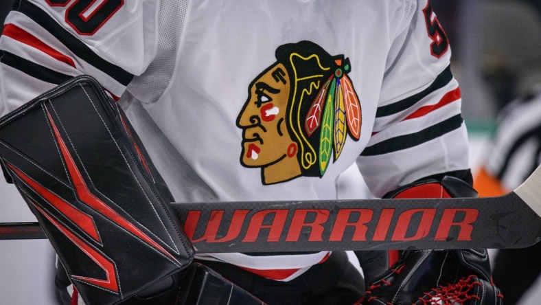 Feb 23, 2020; Dallas, Texas, USA; A view of the logo and hockey stick of Chicago Blackhawks goaltender Corey Crawford (50) in action during the game between the Stars and the Blackhawks at the American Airlines Center. Mandatory Credit: Jerome Miron-USA TODAY Sports