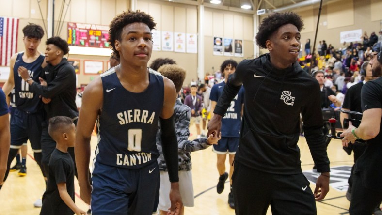 Dec 7, 2019; Scottsdale, AZ, USA; Sierra Canyon School guard LeBron James Jr (0) and teammate Zaire Wade against Millennium High School during the 2019 Hoophall West basketball tournament at Chaparral High School. Mandatory Credit: Mark J. Rebilas-USA TODAY Sports