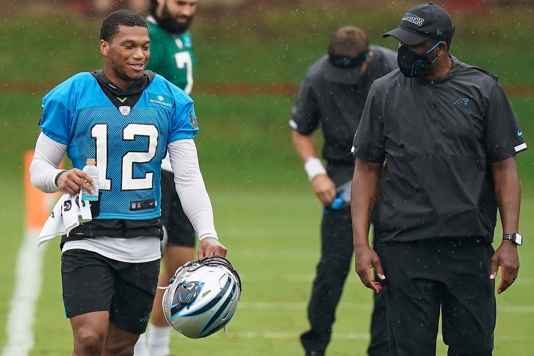 Aug 21, 2020; Charlotte, North Carolina, USA; Carolina Panthers wide receiver DJ Moore (12) talks with Coach Frisman Jackson (right) during training camp at the Panthers training facility. Mandatory Credit: Jim Dedmon-USA TODAY Sports