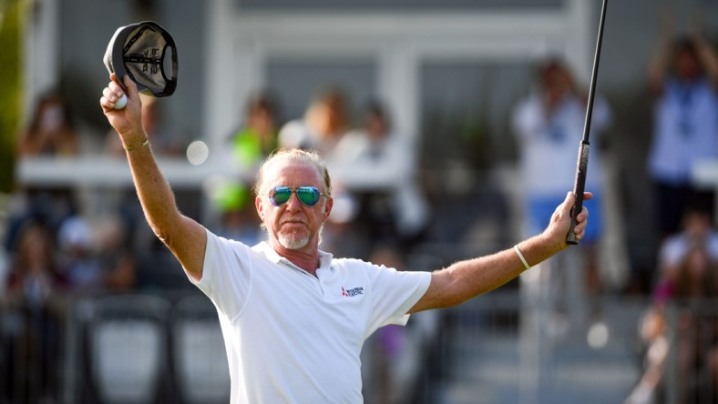 Miguel Angel Jimenez raises his arms after sinking his final putt and winning the Sanford International on Sunday, September 13, at the Minnehaha Country Club in Sioux Falls.

Sanford Intl Day 3 020