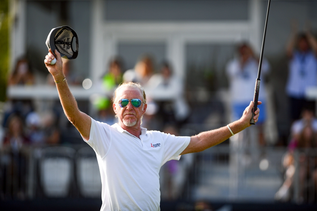 Miguel Angel Jimenez raises his arms after sinking his final putt and winning the Sanford International on Sunday, September 13, at the Minnehaha Country Club in Sioux Falls.

Sanford Intl Day 3 020