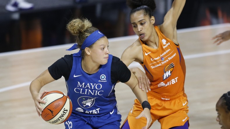 Sep 17, 2020; Palmetto, Florida, USA; Phoenix Mercury guard Skylar Diggins-Smith (right) guards against Minnesota Lynx guard Rachel Banham (15) during the second half at the FELD entertainment complex. Mandatory Credit: Reinhold Matay-USA TODAY Sports